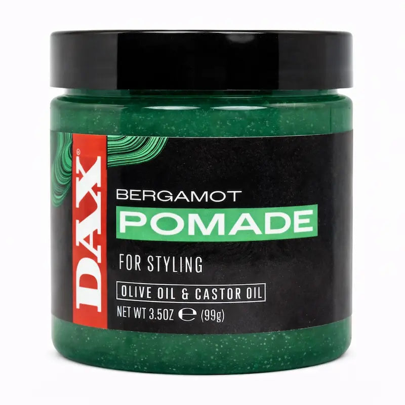 Boîte de pommade capillaire DAX 99g verte aux huiles végétales.