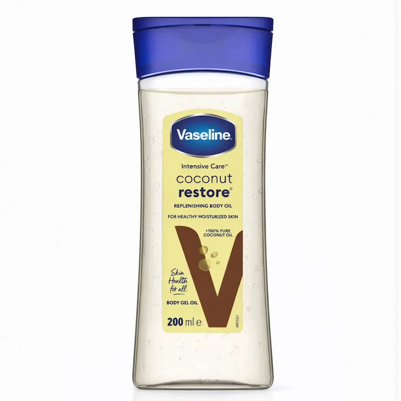 Flacon d'huile corporelle Vaseline Intensive Care Coconut Restore à l'huile de coco.